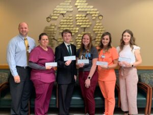 Front left to right: Jeff Gettys, Foundation President; Chantel Garrison; Parker Stilley; Rachel Hutson; Tara Silveus; Elexis Calhoun, scholarship awardees. Not pictured Cora Turnbull, Amber Collins, Madison Graeff